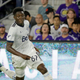 Alphonso Davies playing for Vancouver Whitecaps in Major League Soccer.